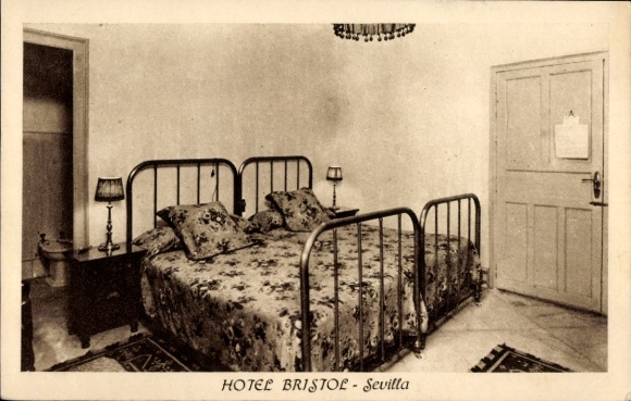 Postcard Sevilla Andalusia, hotel room with two beds, bedside tables, lamps, carpet