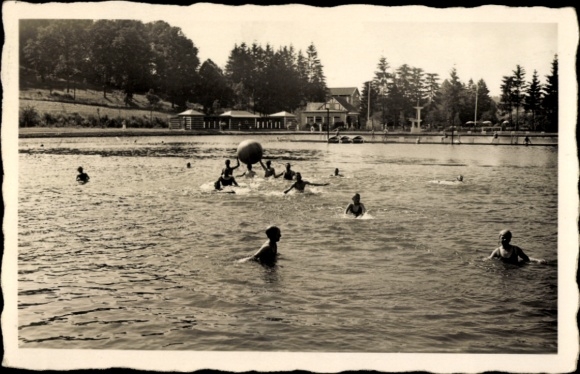Waldbröl in the Oberbergisches Land, people in the water, ball game, outdoor pool, nature, trees, buildings...