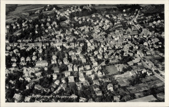 Postcard Bad Pyrmont in Lower Saxony, aerial view of numerous houses, forest, aircraft photo