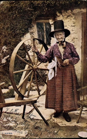 Artist Postcard Wales, Welsh woman in folk costume with a spinning wheel