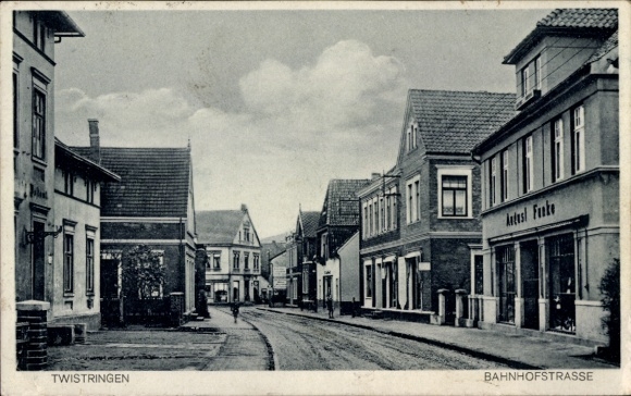 Postcard Twistringen Lower Saxony, street view, Bahnhofstraße, buildings, clouds in the sky
