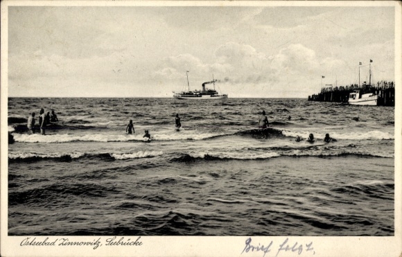Picture of the Baltic Sea resort of Zinnowitz on Usedom, bathers in the water, steamer in the background, pier