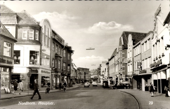 Ak Nordhorn in der Grafschaft Bentheim, Hauptstraße, Geschäfte, Autos, Menschen, Wolken