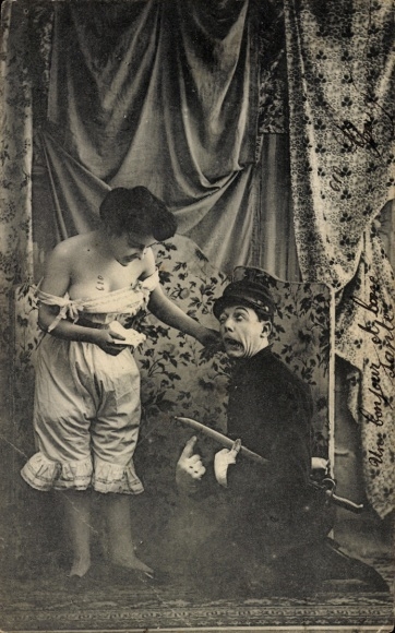 Postcard Woman in petticoat, French soldier on knees
