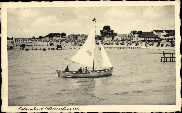 Postcard Baltic resort Kellenhusen in Holstein, sailing boat, view of the beach