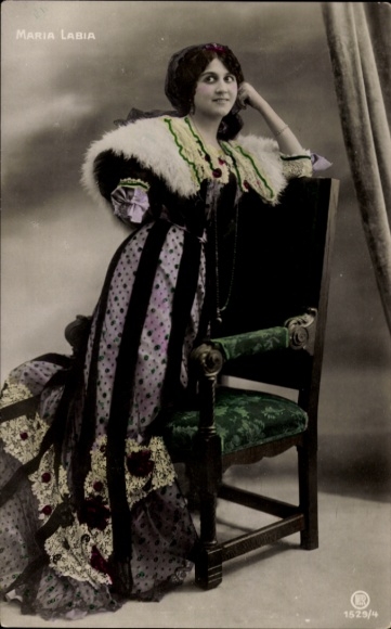 Postcard opera singer Maria Labia, portrait leaning on chair back, colored