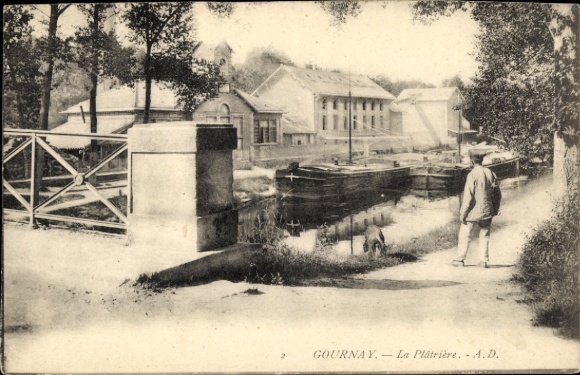 Postcard Gournay sur Marne Seine Saint Denis, view of a canal, man with dog, factory in the background...