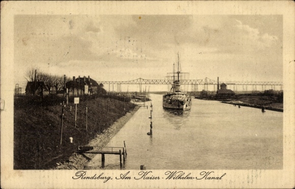 Postcard Rendsburg in Schleswig Holstein, ship in the canal, Kaiser Wilhelm Canal, bridge in the background