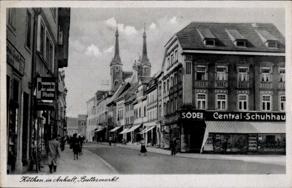 Ak Köthen in Anhalt, Straße mit Gebäuden, Drogerie, Central-Schuhhau, Zwillingstürme
