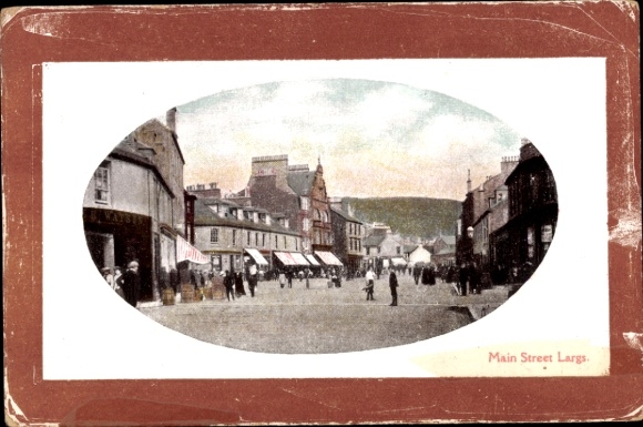 Postcard Largs Scotland, main street of buildings, people, shops