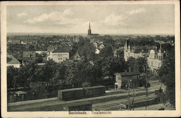 Postcard Buxtehude in Lower Saxony, total view of church building clearly visible, tracks in the foreground