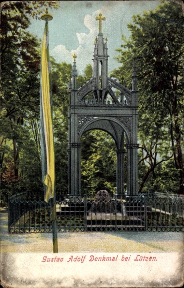 Ak Lützen im Burgenlandkreis, Gustav Adolf Denkmal, umgeben von Bäumen, mit Flagge