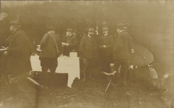 Postcard Dresden Bühlau, men in suits and top hats stand around a set table.