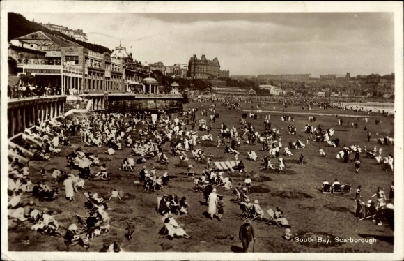 Postcard Scarborough North Yorkshire, South Beach, lots of people, buildings in the background, beach activities...