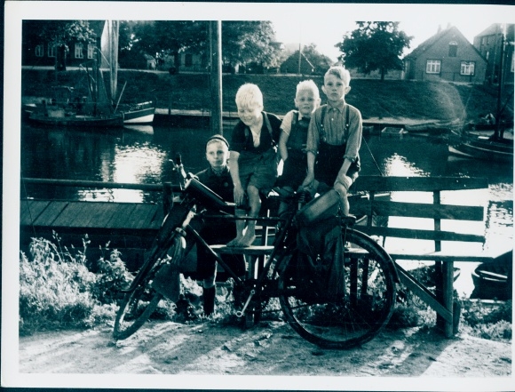 Photo Netherlands?, boys on the bank of a canal, bicycle