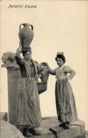 Postcard Two women in traditional costume standing at the well, drawing water, water jug