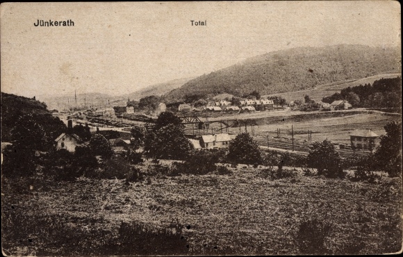 Postcard Jünkerath in the Eifel, total view of the village, railroad tracks