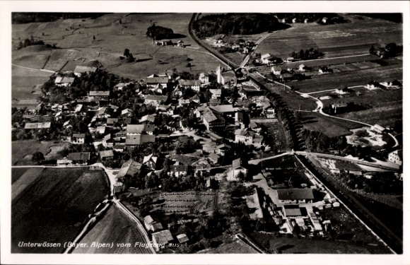 Postcard Unterwössen in Upper Bavaria, aerial view of the Alps, residential buildings, streets, fields