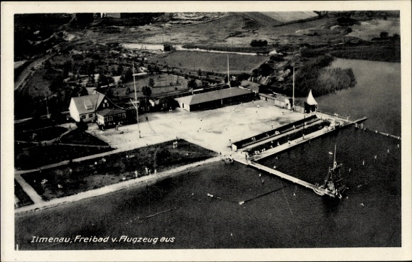 Postcard Ilmenau in Thuringia, aerial photograph of outdoor swimming pool, water surface, buildings, trees, beach