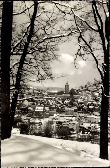 Picture of Siegen in Westphalia, view of snow-covered city, trees in the foreground, photo by Erich Koc
