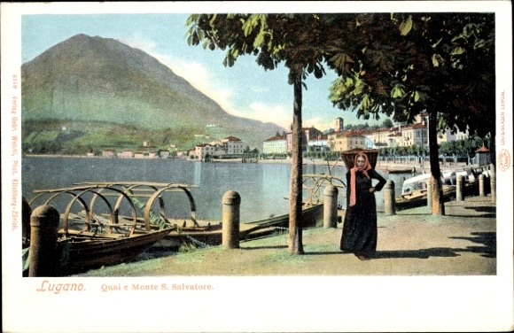 KP Lugano Kanton Ticino Szwajcaria, Monte S. Salvatore, kobieta z parasolem, łodzie na brzegu