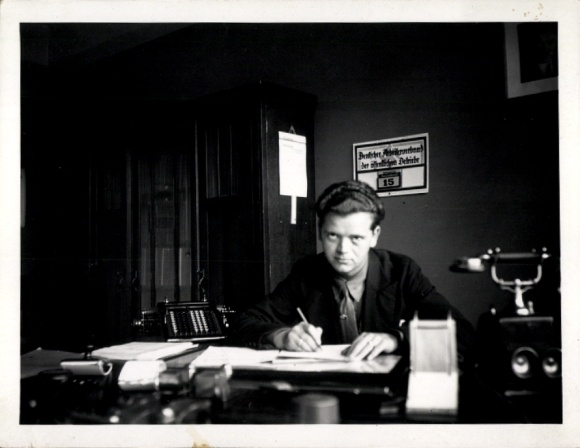 Photo of man at desk, telephone, German Workers' Association of Public Enterprises