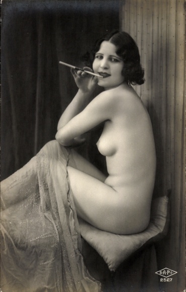 Photo Postcard Seated female nude, cigarette in holder