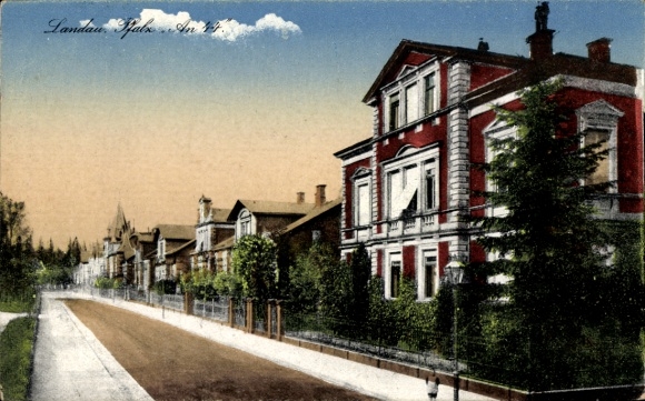 PC Landau in der Pfalz, front side shows a building, street, trees, clouds