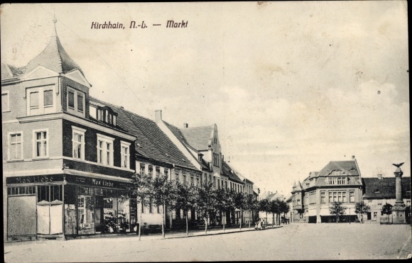 Postcard Kirchhain in Niederlausitz, market, shop Max Liebe, war memorial