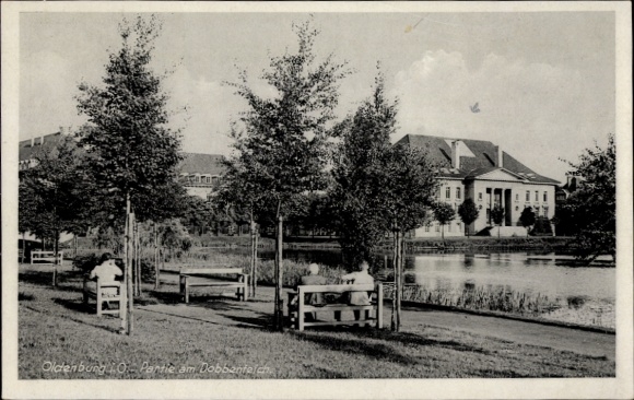 Postcard Oldenburg in Holstein, Park am Dobbentel, trees, benches, buildings in the background