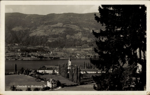 Ak Ossiach in Kärnten, Landschaftsbild, Ossiach, Bodensdorf, See, Berge, Kirche, Bäume