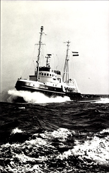 Ansichtkaart L. Smit & Co., DET Schelde, schip in een storm, sleepboot