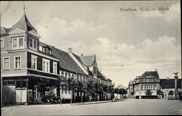 Postcard Doberlug Kirchhain in Brandenburg, market, shop Max Liebe, war memorial