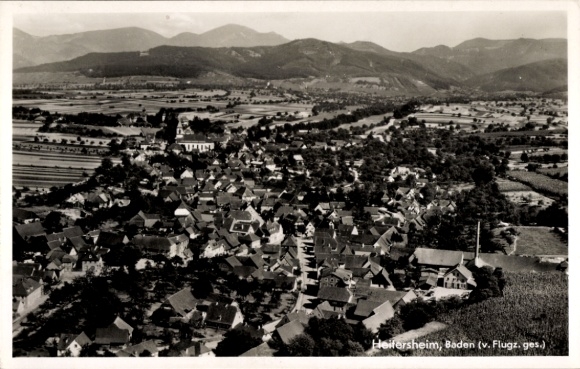 Postcard Heitersheim in the Black Forest, aerial view, Baden, many roofs, mountains in the background