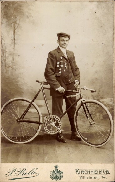 Cabinet Photo Young Man in Suit, Badge, Standing Portrait, Bicycle