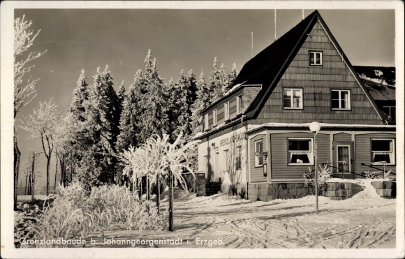 Postcard Johanngeorgenstadt in the Erzgebirge of Saxony, border country cottage in winter
