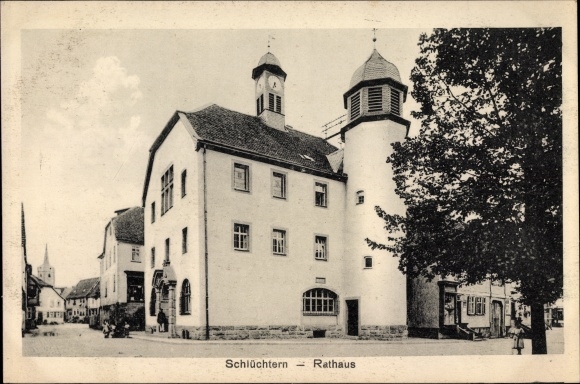 Postcard Schluechtern in the Main Kinzig district, street section at the town hall, passers-by