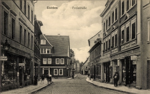 Postcard Lutherstadt Eisleben, Freistraße, row of houses, street view, hairdresser