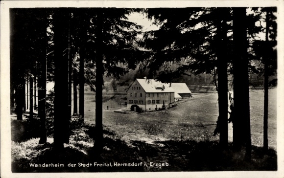 Postcard Hermsdorf in the Ore Mountains, hiking lodge of the city of Freital, building surrounded by trees