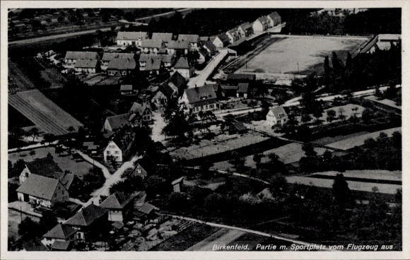 Postcard Birkenfeld an der Nahe, aerial photograph, sports field, residential buildings, landscape