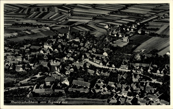 Ak Rheinbischofsheim Rheinau in Baden, Luftaufnahme, viele Häuser, Felder, Kirche