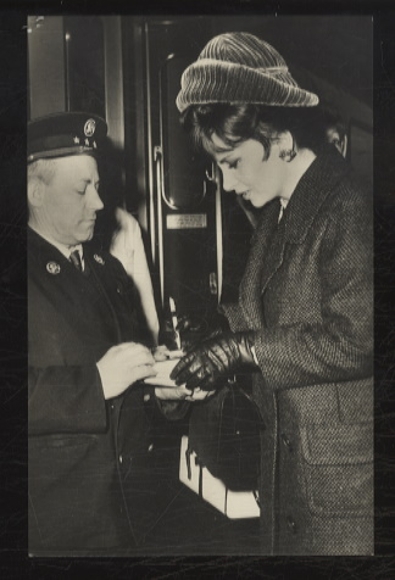 Photograph of Gina Lollobrigida signing an autograph, 1965