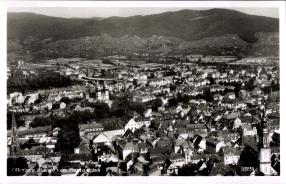 Postcard Offenburg in Baden Black Forest, aerial view of Black Forest in the background, numerous buildings