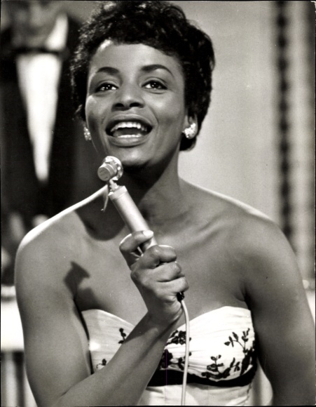 Postcard singer Mona Baptiste, portrait, microphone