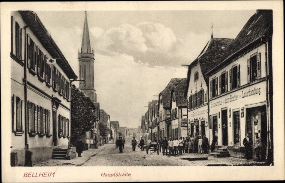 PC Bellheim in the southern Palatinate, main street, leather shop Anton Bumiller, church tower
