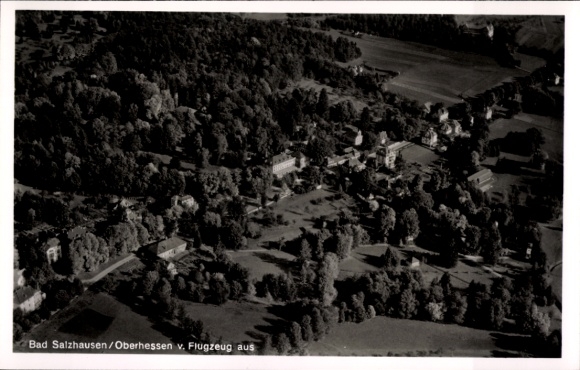 Postcard Bad Salzhausen Nidda in Hesse, aerial view of numerous trees, buildings visible