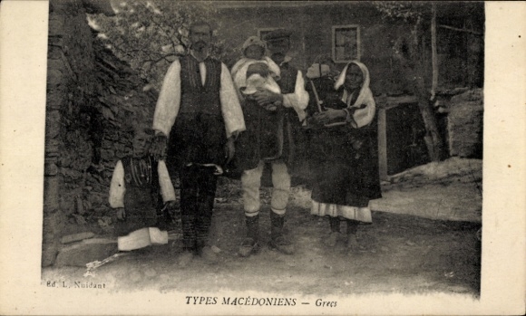 Postcard family in Greek costumes