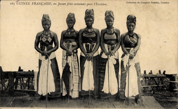 Postcard French Guinea, young women in ceremonial dress before circumcision