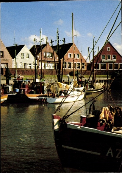 PC Neuharlingersiel in East Frisia, harbor view, ships, traditional architecture, blue...