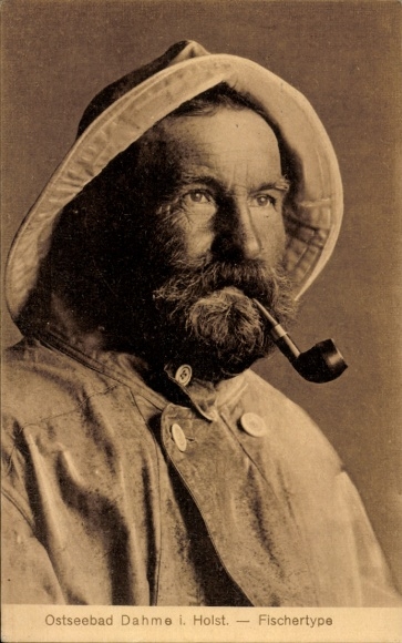 PC Baltic Sea resort of Dahme in Holstein, older man with beard, fishing clothing, hooded smock, r...